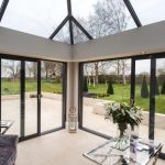 A {large} living room with a {glass} roof in Westbury-On Severn.