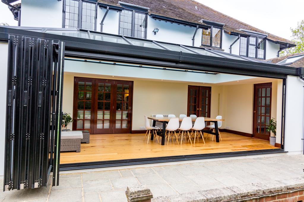 A {house} with a {dining room} and {patio doors}.